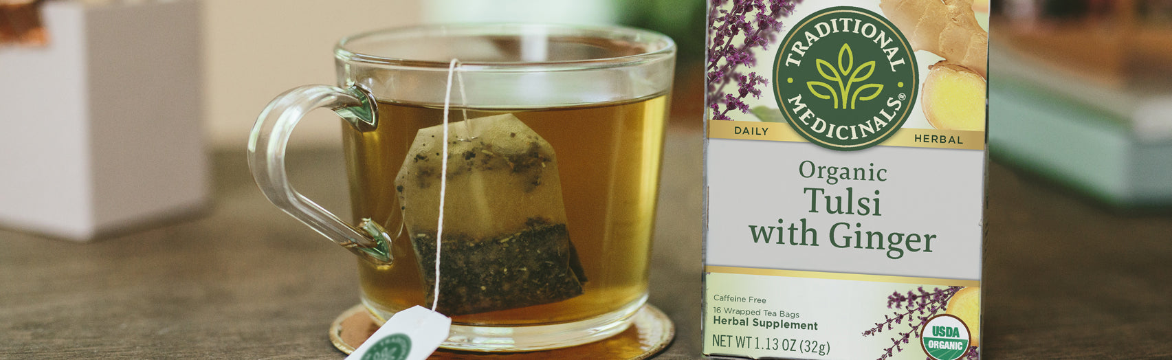 Mug full of Traditional Medicinals Organic Tulsi with Ginger tea
